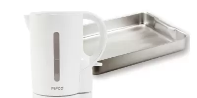 A professional roasting dish next to a non-stick frying pan