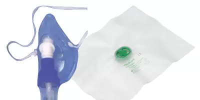 A face mask next to an orange AED