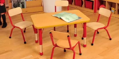 A set of tables and chairs in a nursery