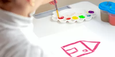 Paint brushes laying on a artist canvas