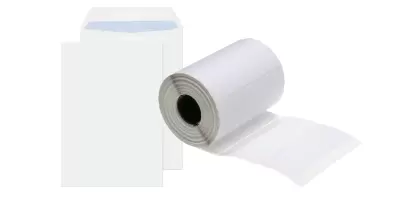 An white envelope next to an a4 sheet of sticky labels