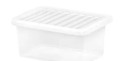 A clear storage box with a white lid